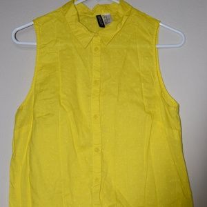 Yellow buttoned down collared shirt